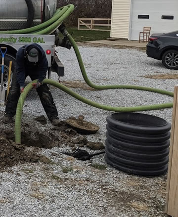 septic tank riser waiting to be installed into a septic tank.